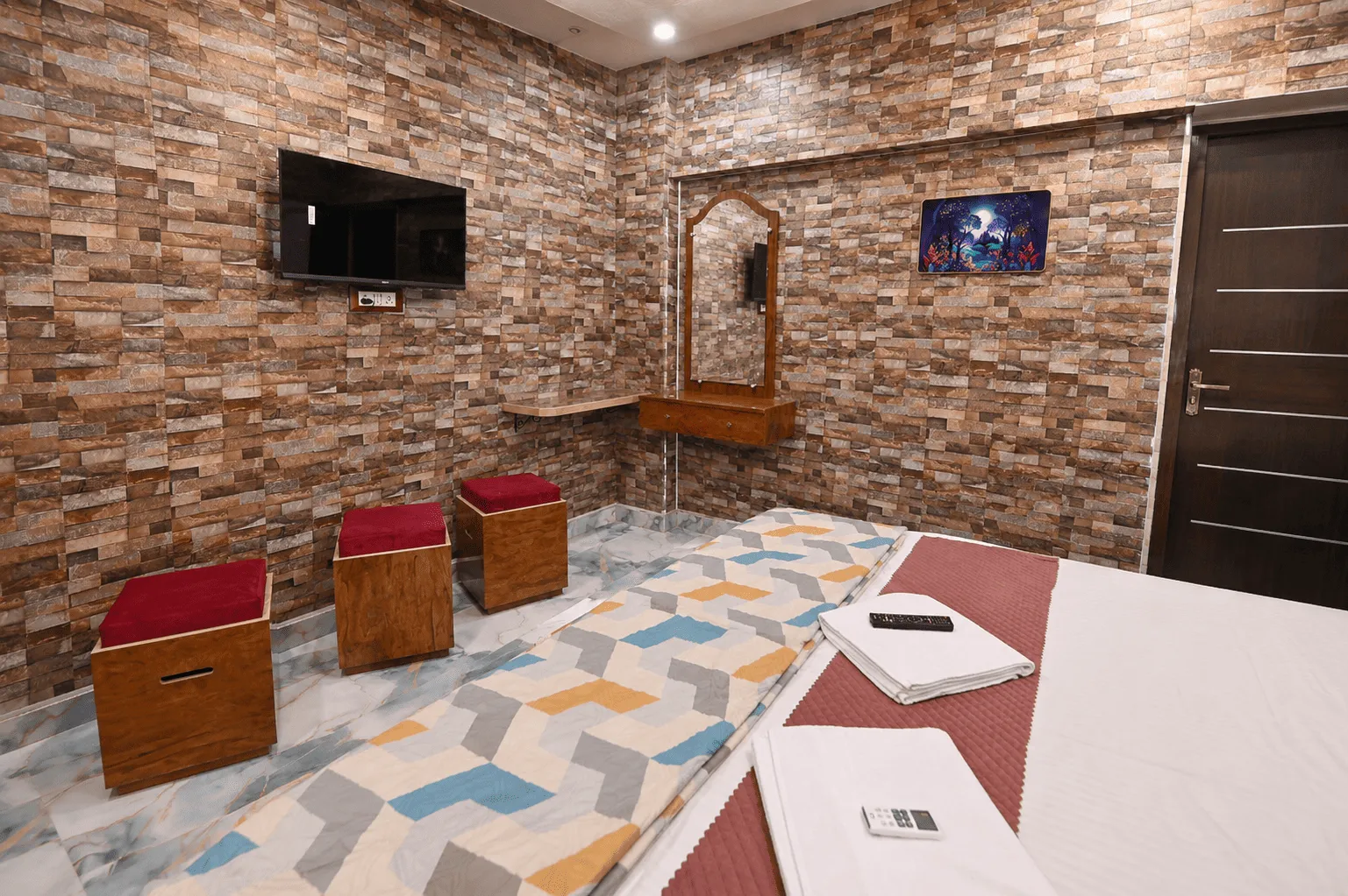 Comfortable guest room at Kashi King Luxury Stay, beside the temple corridor, Varanasi
